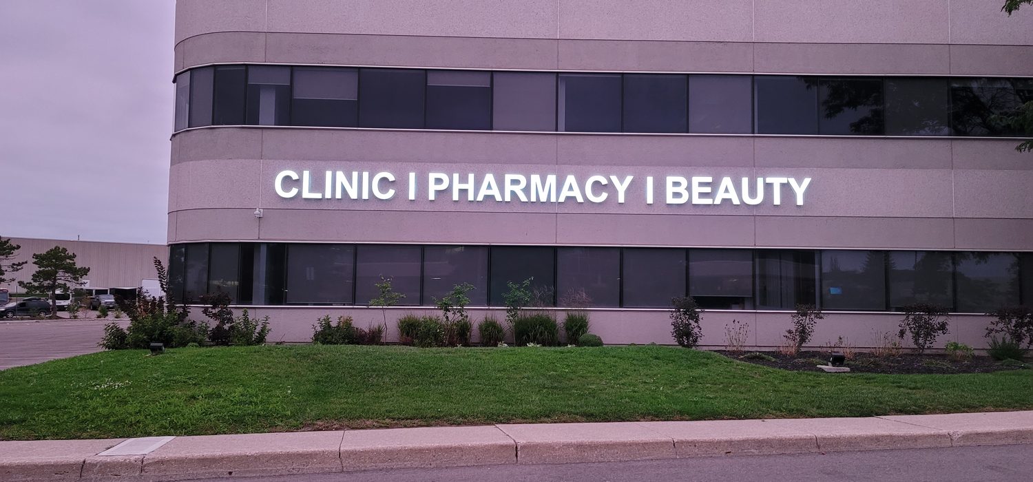 Illuminated building signage for a clinic and pharmacy