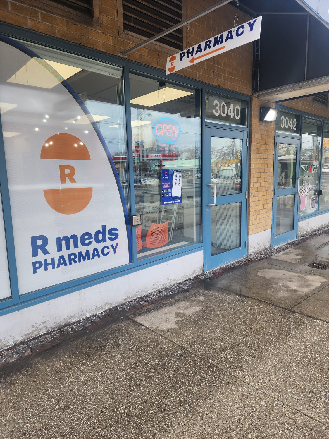 Pharmacy storefront with window graphics
