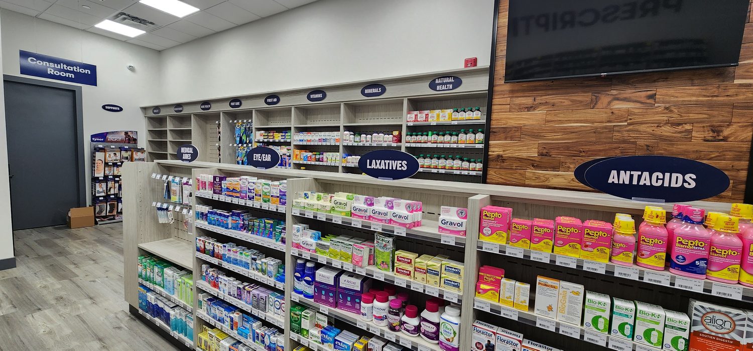 Pharmacy interior with shelving and signage