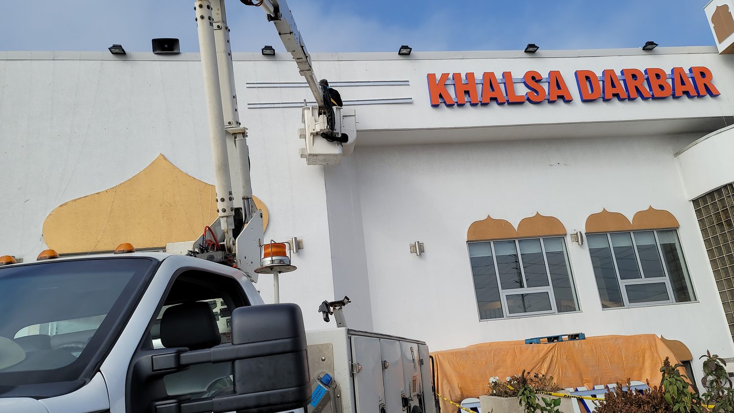 Sign installation with bucket truck